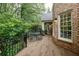 Outdoor deck features dining set and grill, offering a perfect spot for outdoor dining and entertainment at 314 Caruso Ct, Sandy Springs, GA 30350