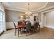Elegant dining room with hardwood floors, chandelier, and stylish furnishings, perfect for entertaining guests at 314 Caruso Ct, Sandy Springs, GA 30350