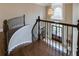 Grand foyer showcasing a curved staircase and wrought iron railings leading to an arched entryway at 314 Caruso Ct, Sandy Springs, GA 30350