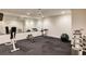Home gym features a large mirror, rubber flooring, and an array of equipment for a complete fitness routine at 314 Caruso Ct, Sandy Springs, GA 30350