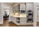 Gourmet kitchen features stainless steel appliances, custom cabinetry, and a view into the formal dining room at 314 Caruso Ct, Sandy Springs, GA 30350