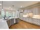 Spacious kitchen with white cabinets, granite countertops, and hardwood floors offers both style and functionality at 314 Caruso Ct, Sandy Springs, GA 30350