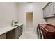 Well-appointed laundry room with modern appliances and countertop space at 314 Caruso Ct, Sandy Springs, GA 30350