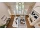 Open concept living room featuring high ceilings, a fireplace, and access to a private outdoor deck at 314 Caruso Ct, Sandy Springs, GA 30350