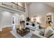 Bright living room featuring an upper level balcony and hardwood floors at 314 Caruso Ct, Sandy Springs, GA 30350