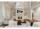 Bright living room featuring a fireplace, cathedral ceiling, large windows, and hardwood floors at 314 Caruso Ct, Sandy Springs, GA 30350