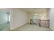 Spacious loft area with a window, chandelier, and a view to a lower level bedroom at 314 Caruso Ct, Sandy Springs, GA 30350
