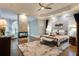 Main bedroom with fireplace, trey ceilings, hardwood floors, and sitting area at 314 Caruso Ct, Sandy Springs, GA 30350