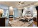 Serene main bedroom with a fireplace, tray ceiling, and a seating area at 314 Caruso Ct, Sandy Springs, GA 30350