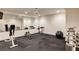 Basement home gym features rubber flooring, a full mirror, and a variety of workout equipment at 314 Caruso Ct, Sandy Springs, GA 30350
