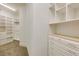 Walk-in closet featuring built-in shelving, drawers, and ample storage space at 314 Caruso Ct, Sandy Springs, GA 30350