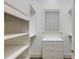Well-organized walk-in closet with shelving, drawers, and a window for natural light at 314 Caruso Ct, Sandy Springs, GA 30350