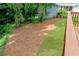View of the backyard featuring a lush lawn and a deck, perfect for outdoor enjoyment and entertaining at 347 Chip Rd, Stone Mountain, GA 30087