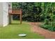 Spacious backyard with a wooden deck and lush greenery that creates a serene and peaceful outdoor living space at 347 Chip Rd, Stone Mountain, GA 30087