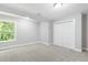 Well-lit bedroom with a window overlooking lush greenery at 347 Chip Rd, Stone Mountain, GA 30087