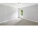 Cozy bedroom featuring soft gray carpet, natural lighting and neutral paint at 347 Chip Rd, Stone Mountain, GA 30087