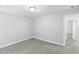 Modern bedroom with gray carpet, neutral walls, and white trim for a clean look at 347 Chip Rd, Stone Mountain, GA 30087