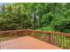 Wood deck with railing overlooking lush greenery at 347 Chip Rd, Stone Mountain, GA 30087
