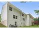 Back of home with white siding and well-kept lawn at 347 Chip Rd, Stone Mountain, GA 30087