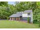 Side view of a modern home with a covered porch, lush greenery, and inviting curb appeal at 347 Chip Rd, Stone Mountain, GA 30087