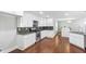 Bright kitchen features stainless appliances, granite countertops, sleek white cabinetry at 347 Chip Rd, Stone Mountain, GA 30087