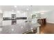 Bright kitchen features granite countertops, stainless steel appliances, and sleek white cabinetry at 347 Chip Rd, Stone Mountain, GA 30087