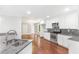 Open kitchen features stainless steel appliances, granite countertops and hardwood flooring at 347 Chip Rd, Stone Mountain, GA 30087