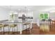 Modern kitchen featuring white cabinetry, stainless steel appliances, and a breakfast bar with seating at 347 Chip Rd, Stone Mountain, GA 30087