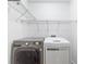 Laundry room with a side by side washer and dryer with wire shelving at 347 Chip Rd, Stone Mountain, GA 30087