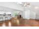 Open-concept space with hardwood floors connecting the living area, kitchen, and dining spaces at 347 Chip Rd, Stone Mountain, GA 30087
