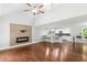 Open-concept living area featuring hardwood floors, fireplace, and a stylish kitchen with breakfast bar at 347 Chip Rd, Stone Mountain, GA 30087