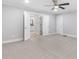 Spacious main bedroom with a ceiling fan, carpet, and bathroom access with double doors at 347 Chip Rd, Stone Mountain, GA 30087