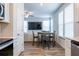 Dining area with wood-look floors, ample windows, and an open concept design at 4700 Blake Loop, Atlanta, GA 30349