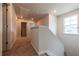 Upstairs hallway with carpeted flooring and neutral walls leading to a bedroom at 4700 Blake Loop, Atlanta, GA 30349