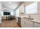 Bright kitchen with white cabinets, stainless steel appliances, quartz countertops, and modern fixtures at 4700 Blake Loop, Atlanta, GA 30349