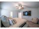 Large main bedroom featuring a ceiling fan, carpet, and mounted television at 4700 Blake Loop, Atlanta, GA 30349