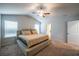 Bright main bedroom showcasing a neutral color palette, carpet floors, and a ceiling fan at 4700 Blake Loop, Atlanta, GA 30349