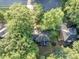 Overhead shot features a backyard with a deck or patio, surrounded by lush trees, with neighboring houses nearby at 4817 Overland Dr, Powder Springs, GA 30127