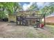 Backyard view with multi-level deck, stairs, shade, lawn and brick siding at 4817 Overland Dr, Powder Springs, GA 30127