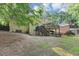 Backyard view with multi-level deck, stairs, shade, lawn and brick siding at 4817 Overland Dr, Powder Springs, GA 30127