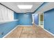 Finished basement featuring neutral carpet, blue walls and plenty of natural light at 4817 Overland Dr, Powder Springs, GA 30127