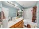 Bathroom with a single sink vanity and a shower-tub combo at 4817 Overland Dr, Powder Springs, GA 30127