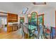 Dining room with a glass table, chairs, skylight, and built-in shelving at 4817 Overland Dr, Powder Springs, GA 30127