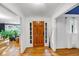 Welcoming foyer featuring hardwood floors, elegant trim, and a stylish front door at 4817 Overland Dr, Powder Springs, GA 30127