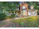 Charming two-story home boasting a brick facade, covered porch, and a two-car garage at 4817 Overland Dr, Powder Springs, GA 30127