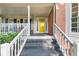 The front porch is highlighted by a bright yellow door and steps leading up to it at 4817 Overland Dr, Powder Springs, GA 30127