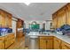 Spacious kitchen with wood cabinets, modern appliances, and a skylight that brings in natural light at 4817 Overland Dr, Powder Springs, GA 30127