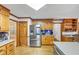Bright and well-equipped kitchen with plenty of wood cabinets, modern appliances, and adjacent desk and breakfast area at 4817 Overland Dr, Powder Springs, GA 30127