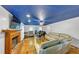 Bright living room with hardwood floors, fireplace, and large windows providing natural light at 4817 Overland Dr, Powder Springs, GA 30127