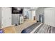 Spacious main bedroom featuring carpet flooring, chandelier, and TV at 4817 Overland Dr, Powder Springs, GA 30127